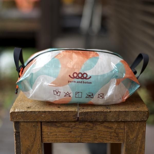 perm and baton  Center Zip SACK M